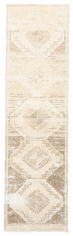 Full top view of the beige and brown geometric vintage Anatolian runner on a white background