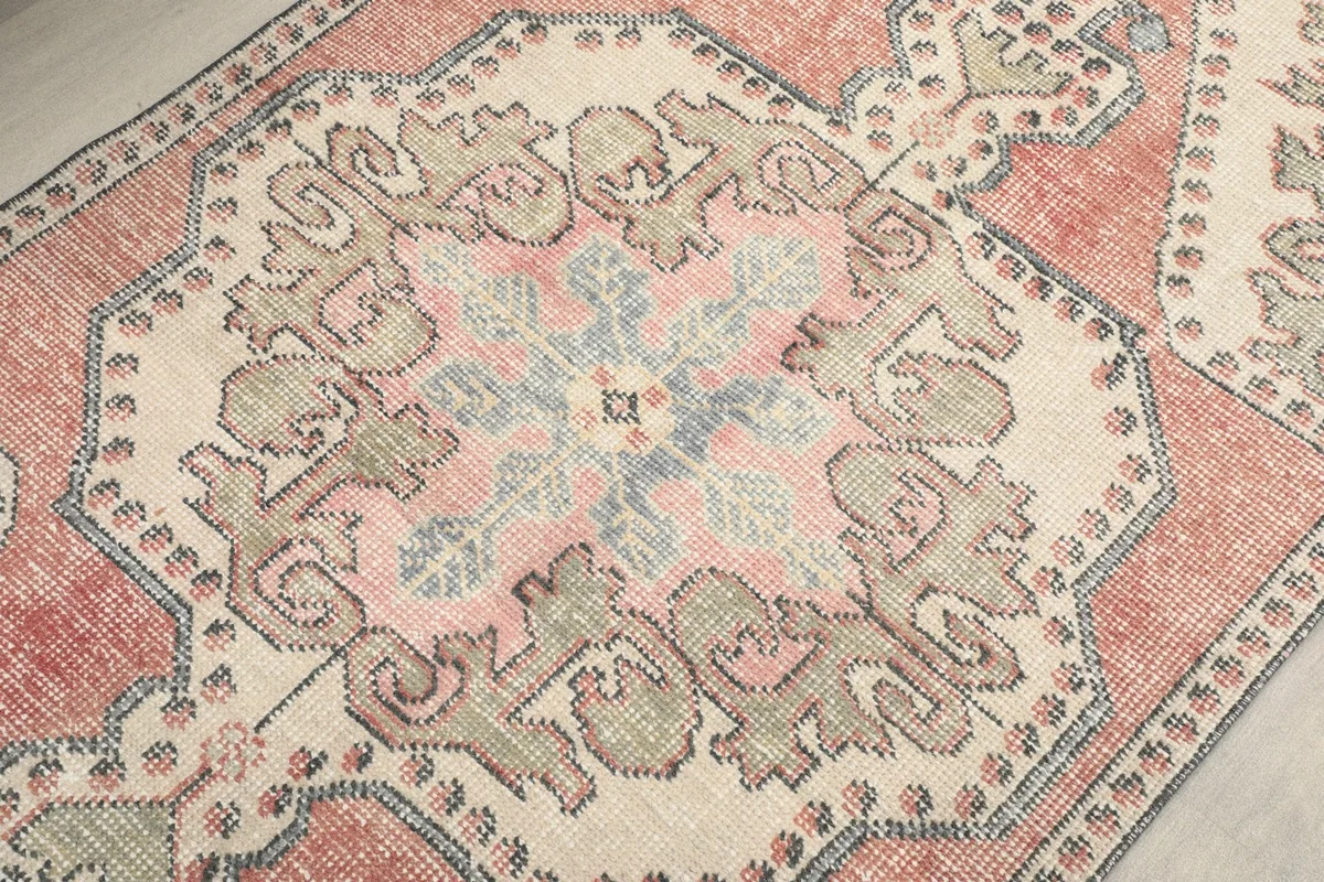 Close-up of the central medallion design, showcasing the intricate patterns and color variations.