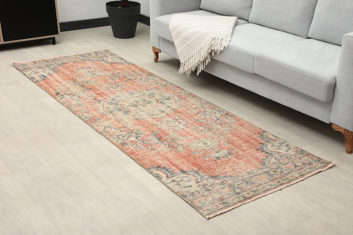 Angle view of the runner rug in a living room, highlighting its length and placement