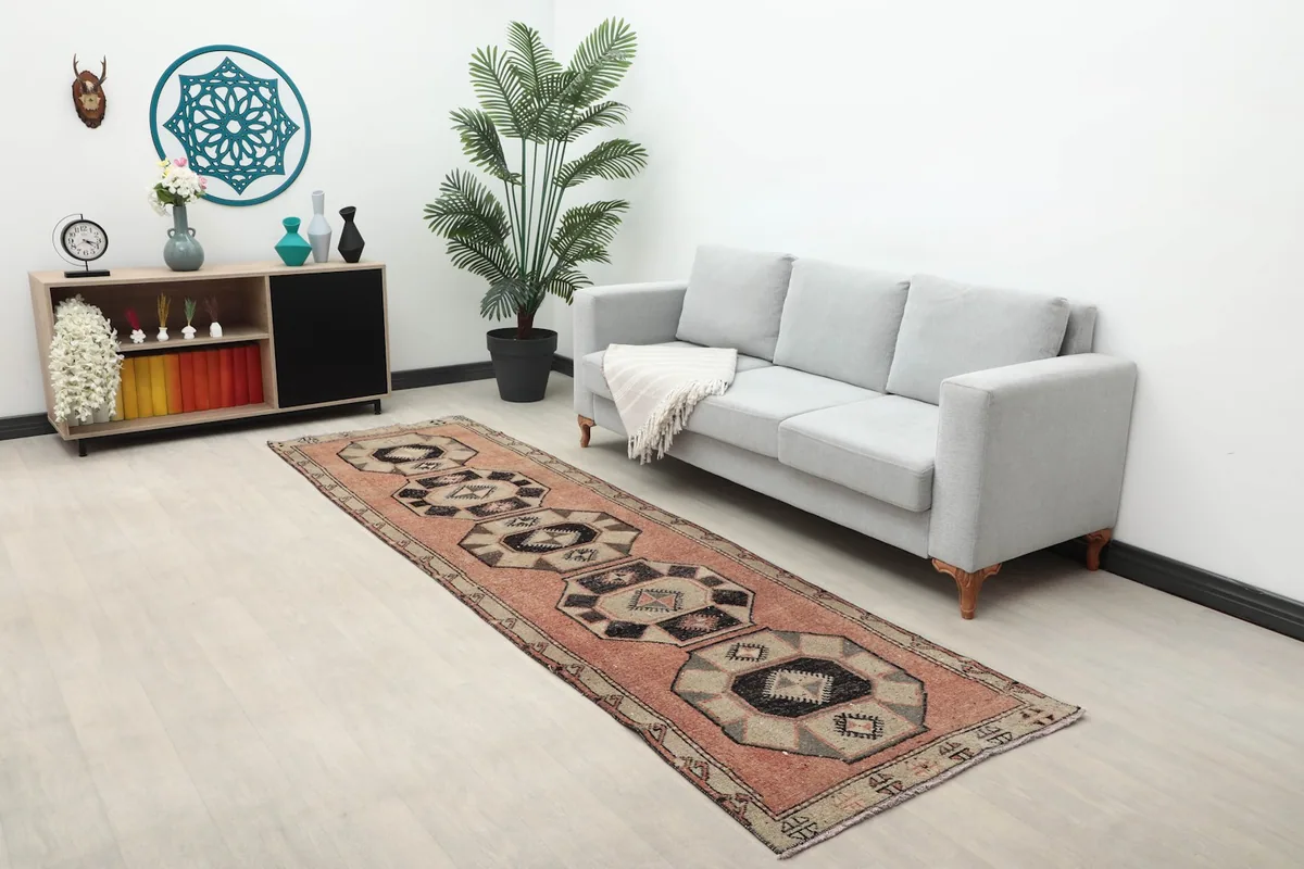 Wide shot of the runner rug in a living space, highlighting its scale and pattern
