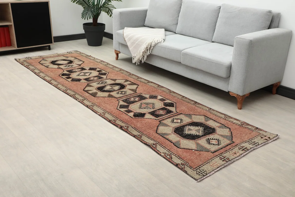 Angle view of the runner rug in a room, showing its texture and color variation