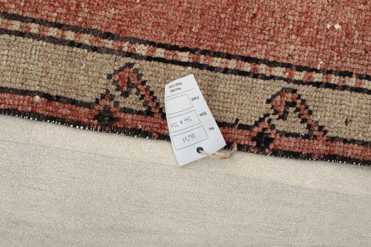 Close-up of the rug's label, showing dimensions and other product information