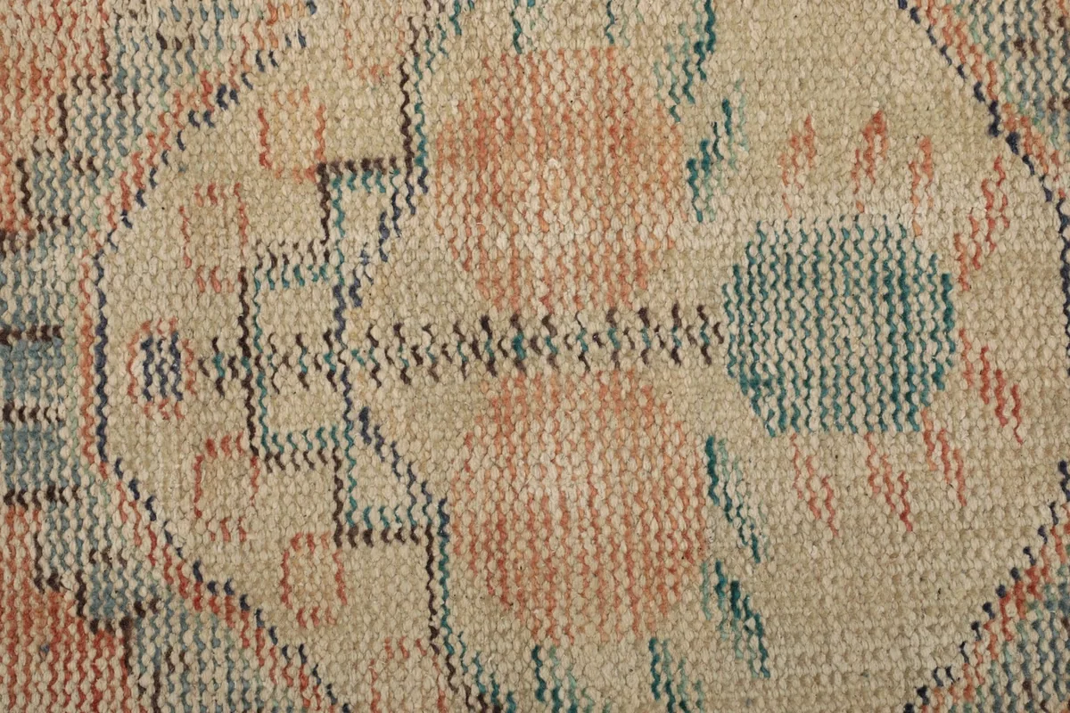 Macro view of the hand-knotted wool pile and weave texture of the rug