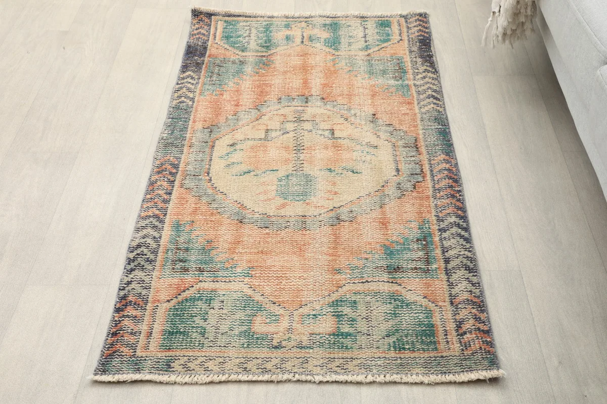 Overhead view of the vintage Anatolian rug on a light floor