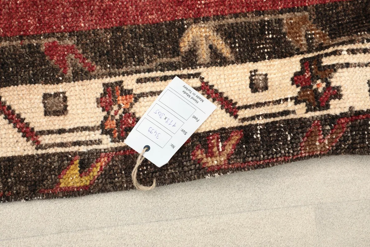 Product tag attached to the rug, showing details and craftsmanship