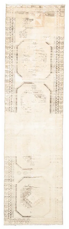 Full top view of the 3'0" x 8'3" beige and brown geometric vintage Anatolian runner rug