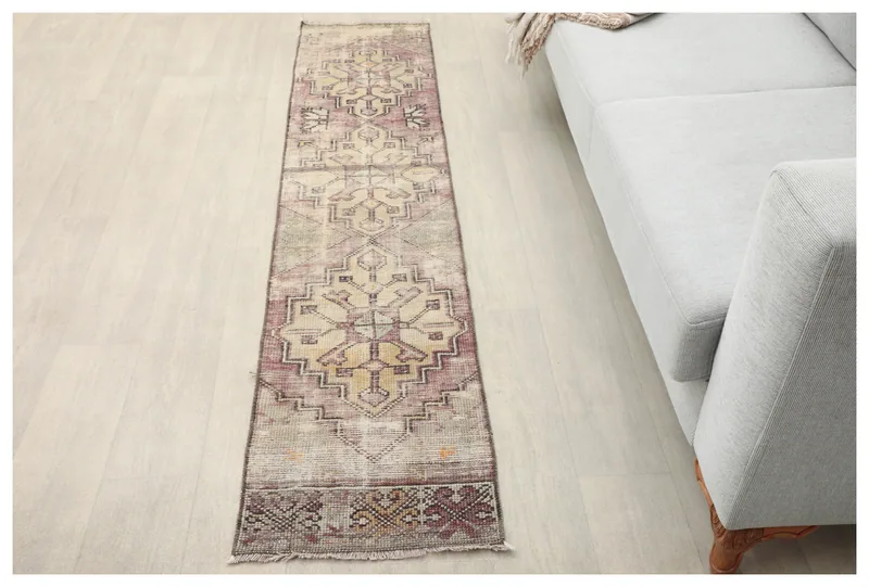 Full top view of the vintage rose and beige geometric runner on a white background