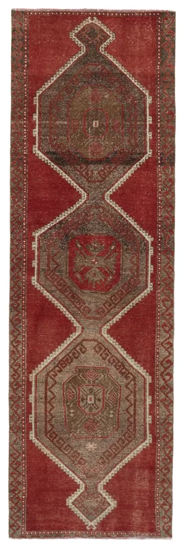 Full top view of the vintage Anatolian runner rug with red field and tribal medallion patterns