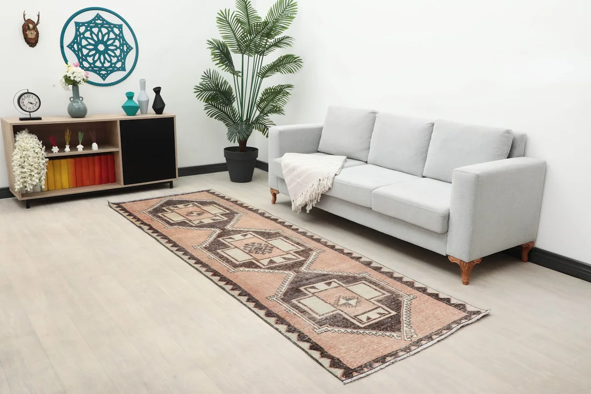 Wide shot of the runner in a hallway or living space with furniture