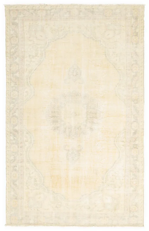 Full top view of the vintage Anatolian rug with an ivory field and faded rose and gray patterns