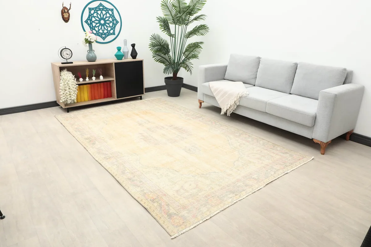 Wide shot of the ivory Anatolian rug in a living space, showcasing its overall appearance