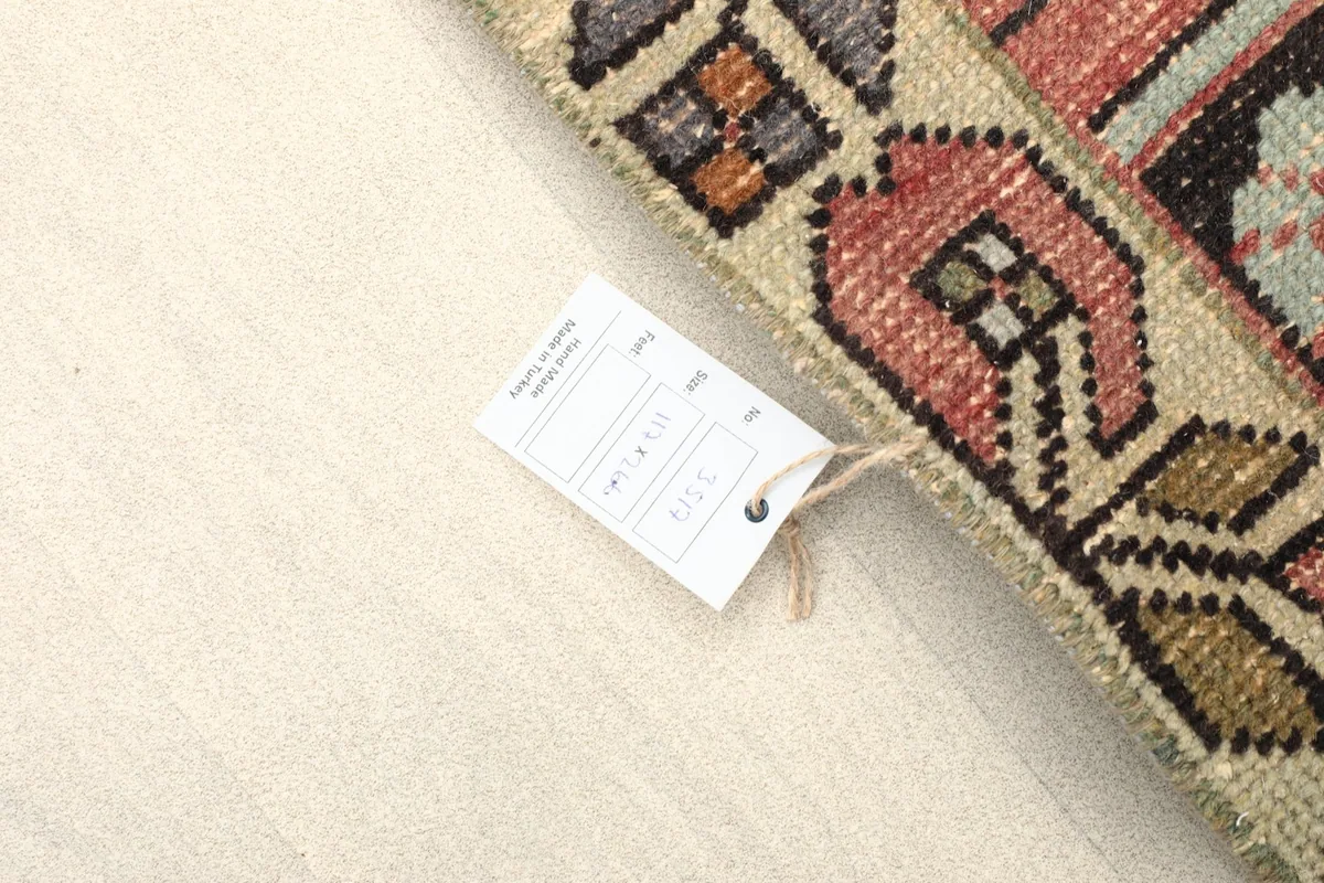 Tag attached to the rug's corner, indicating its details and origin