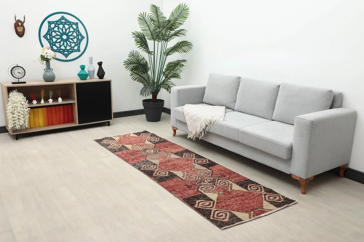 Longer view of the runner in a living space, showing its scale and pattern in context