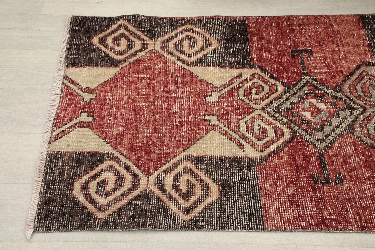 Close-up of the other end of the rug, showing the hand-knotted texture and color variations