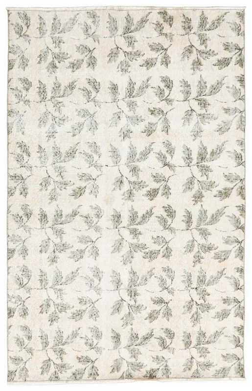 Full overhead view of the 5'1" x 7'11" ivory vintage Anatolian area rug with olive and gray leaf pattern
