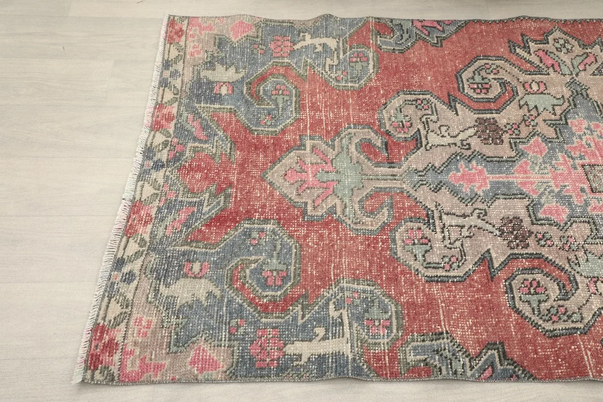 Angled view of the rug's surface, highlighting the detailed motifs and colors