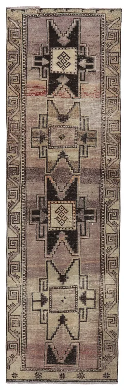 Full top view of the 3'1" x 10'8" vintage Anatolian runner with geometric tribal patterns in rose, beige, and charcoal.