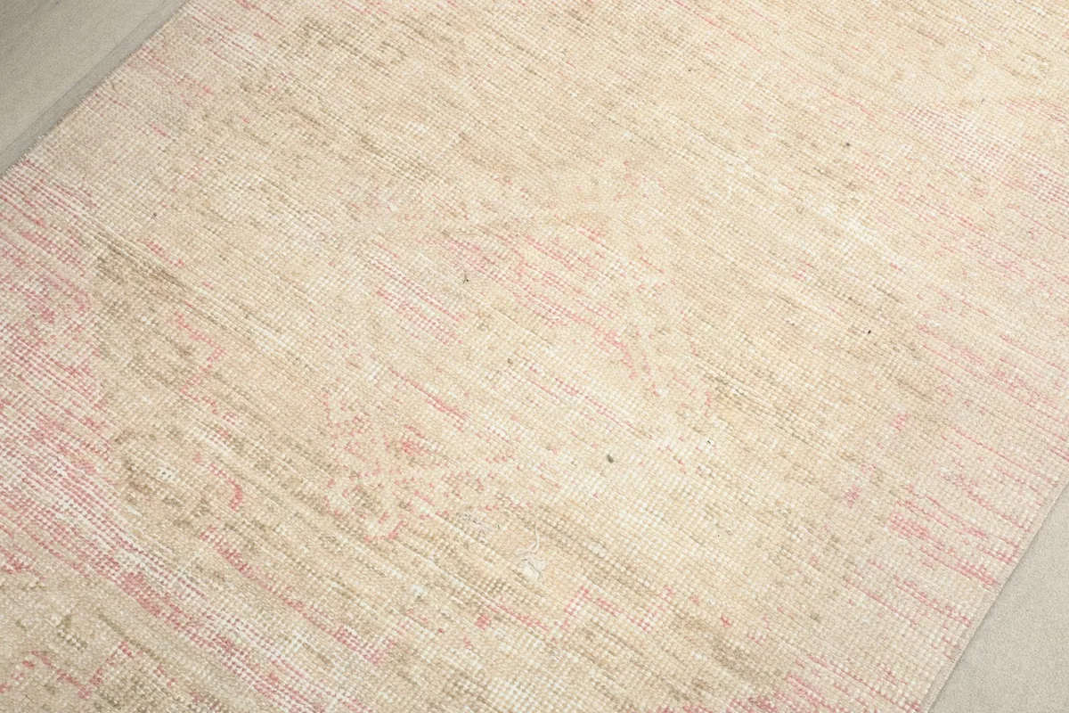 Close-up of the low pile texture and hand-knotted wool surface of the runner