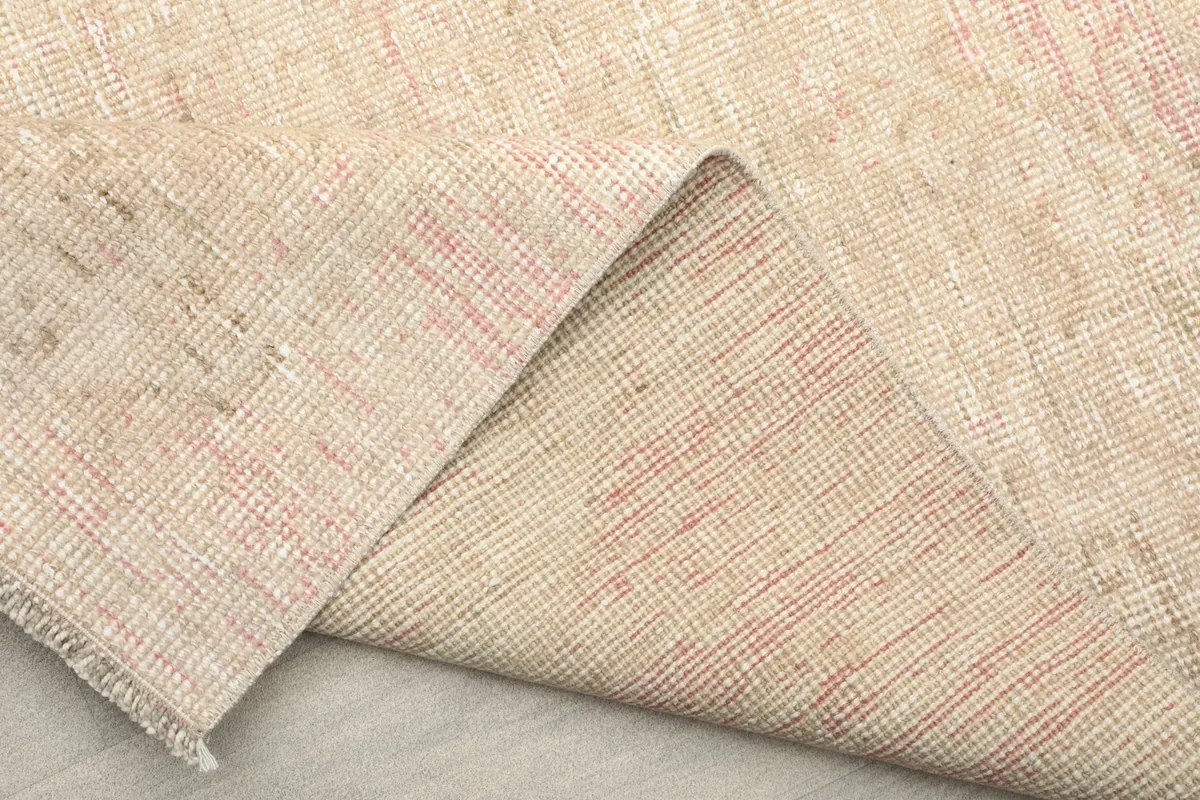 Another view of the rug's underside, revealing the sturdy cotton foundation