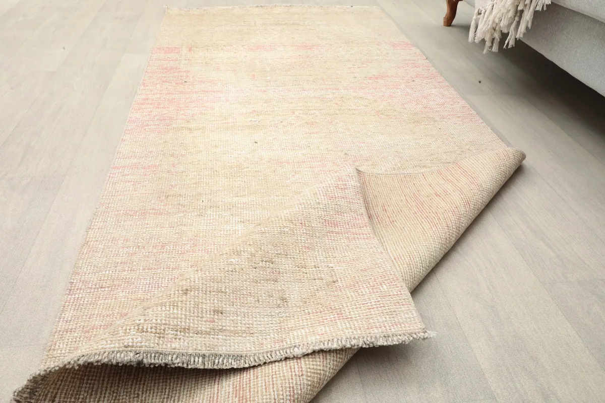 The runner partially folded, showcasing its flexibility and the reverse side