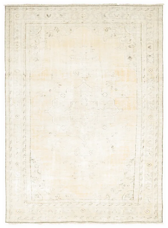 Full overhead view of the cream vintage Anatolian area rug with a subtle medallion design