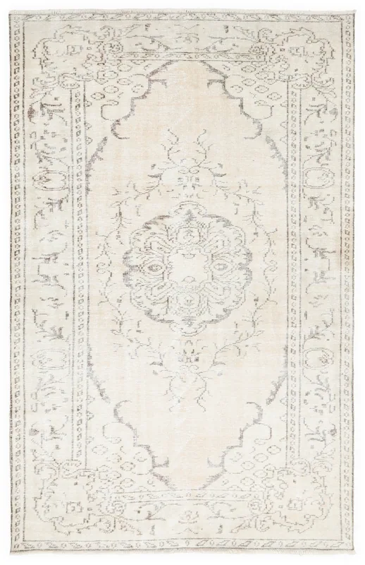 Full top view of the 5'6" x 8'6" vintage Anatolian rug with ivory field and gray medallion