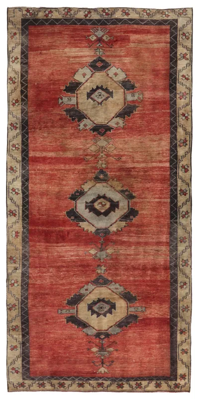 Full overhead view of the Red Anatolian Medallion Runner on a white background