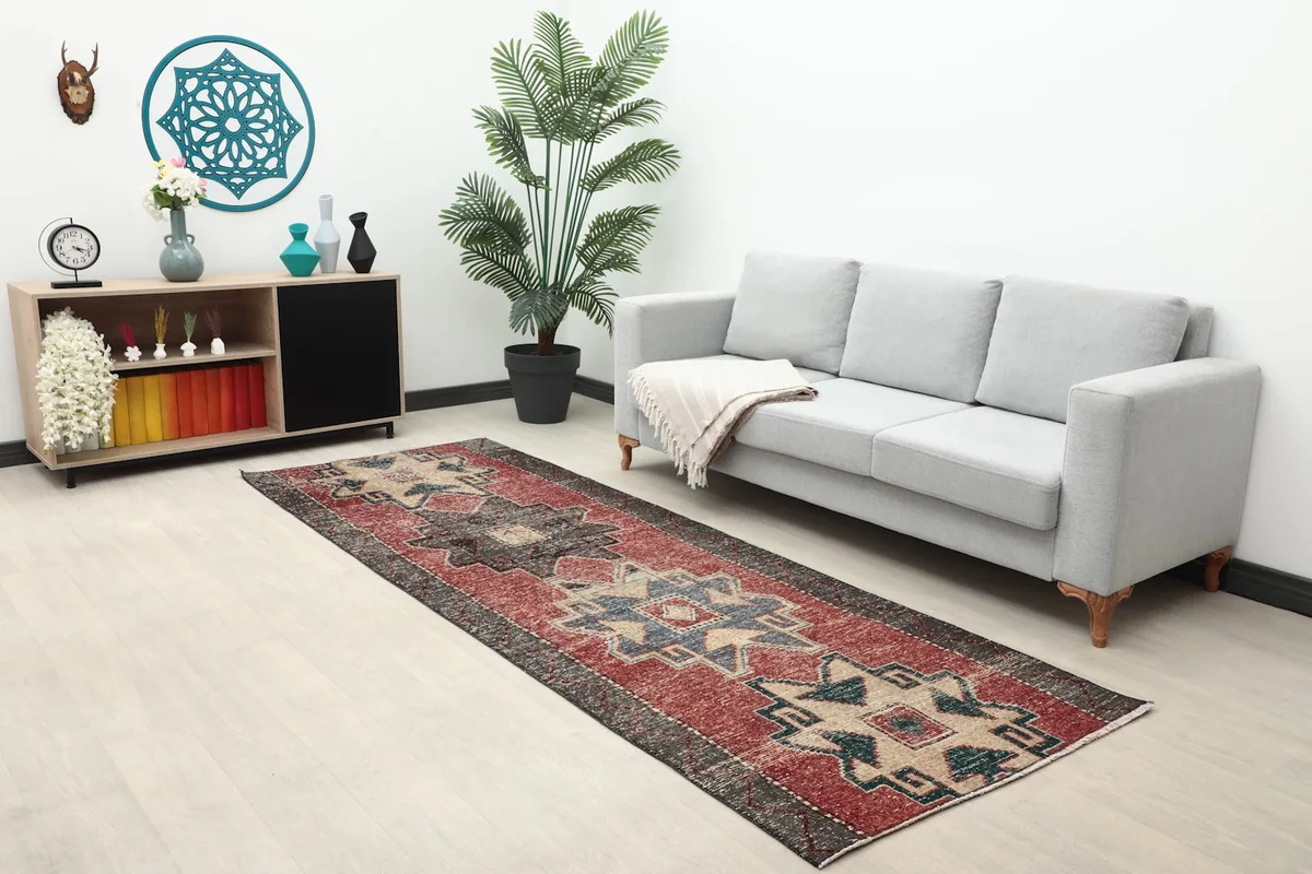 Full room view showing the rust and gray runner rug complementing modern furniture.