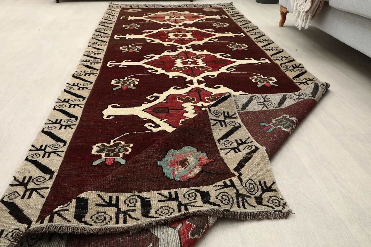 The runner folded to show the thickness and texture of the vintage wool