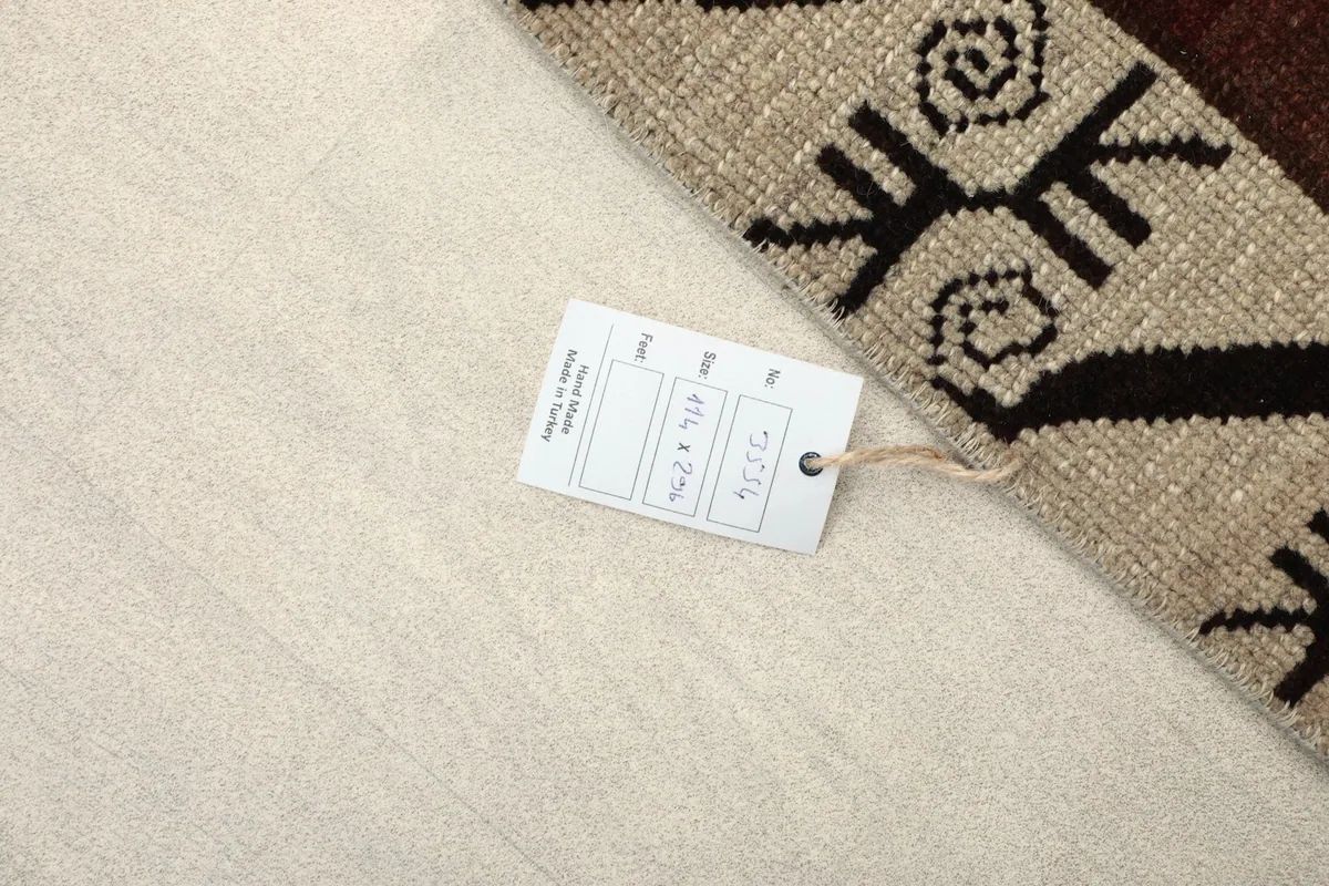 Care tag on the back of the rug, showing size and origin details