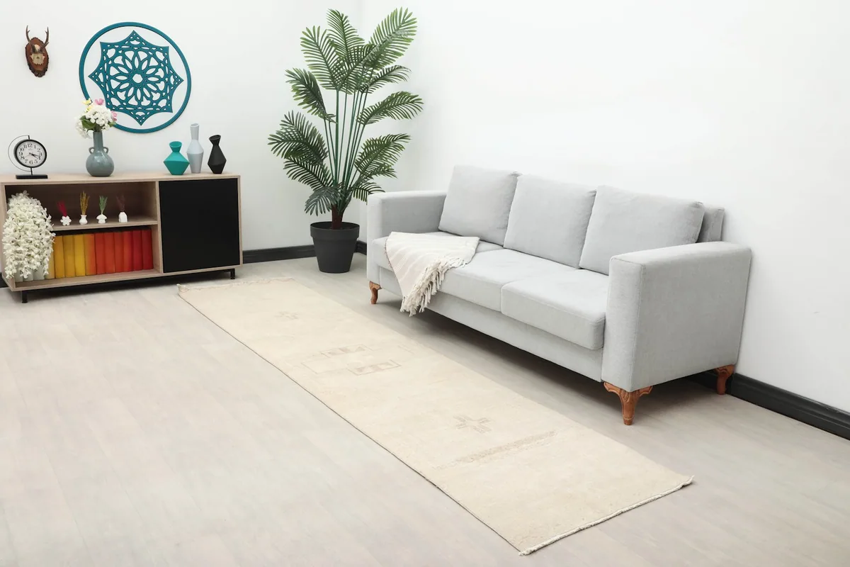 Long view of the ivory runner in a living space with a sofa and decor