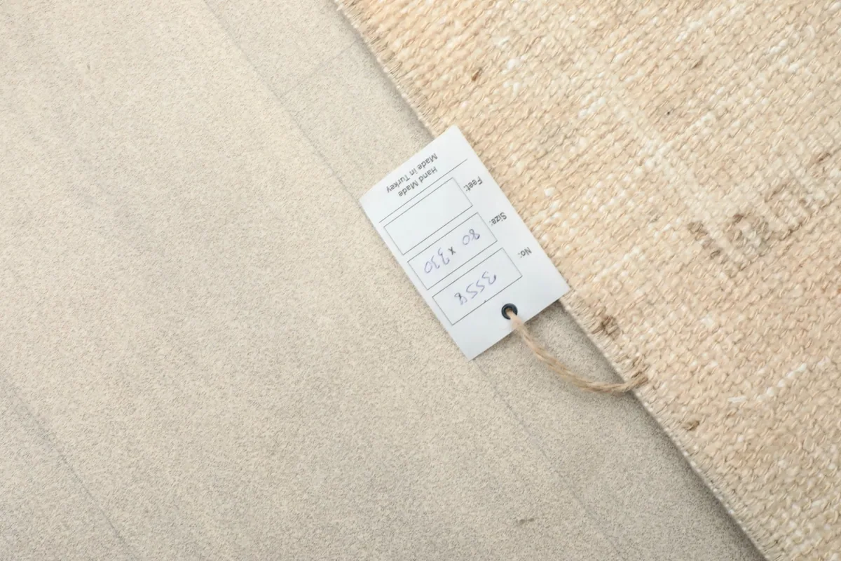 Product tag attached to the rug, displaying size and other rug details