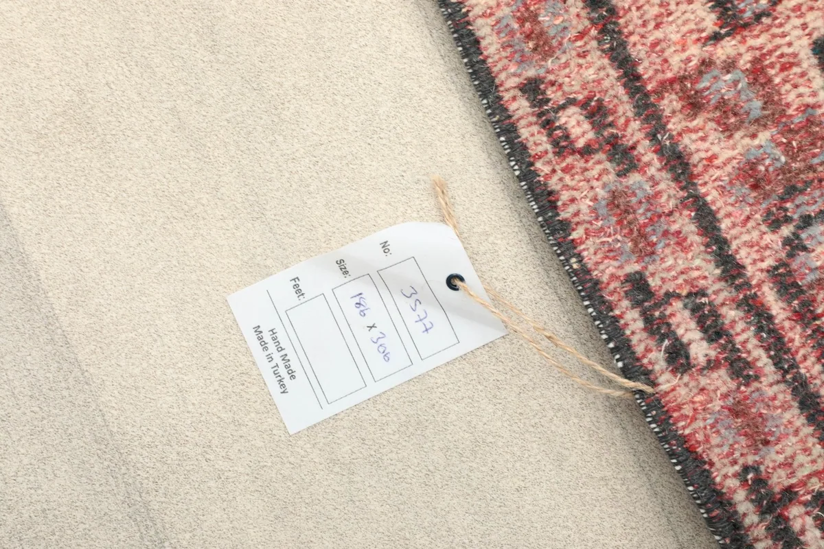 Product tag attached to the rug, showing details like size and origin