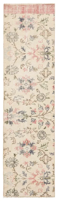 Full top view of the cream, rose, and blue floral Anatolian runner on a white background