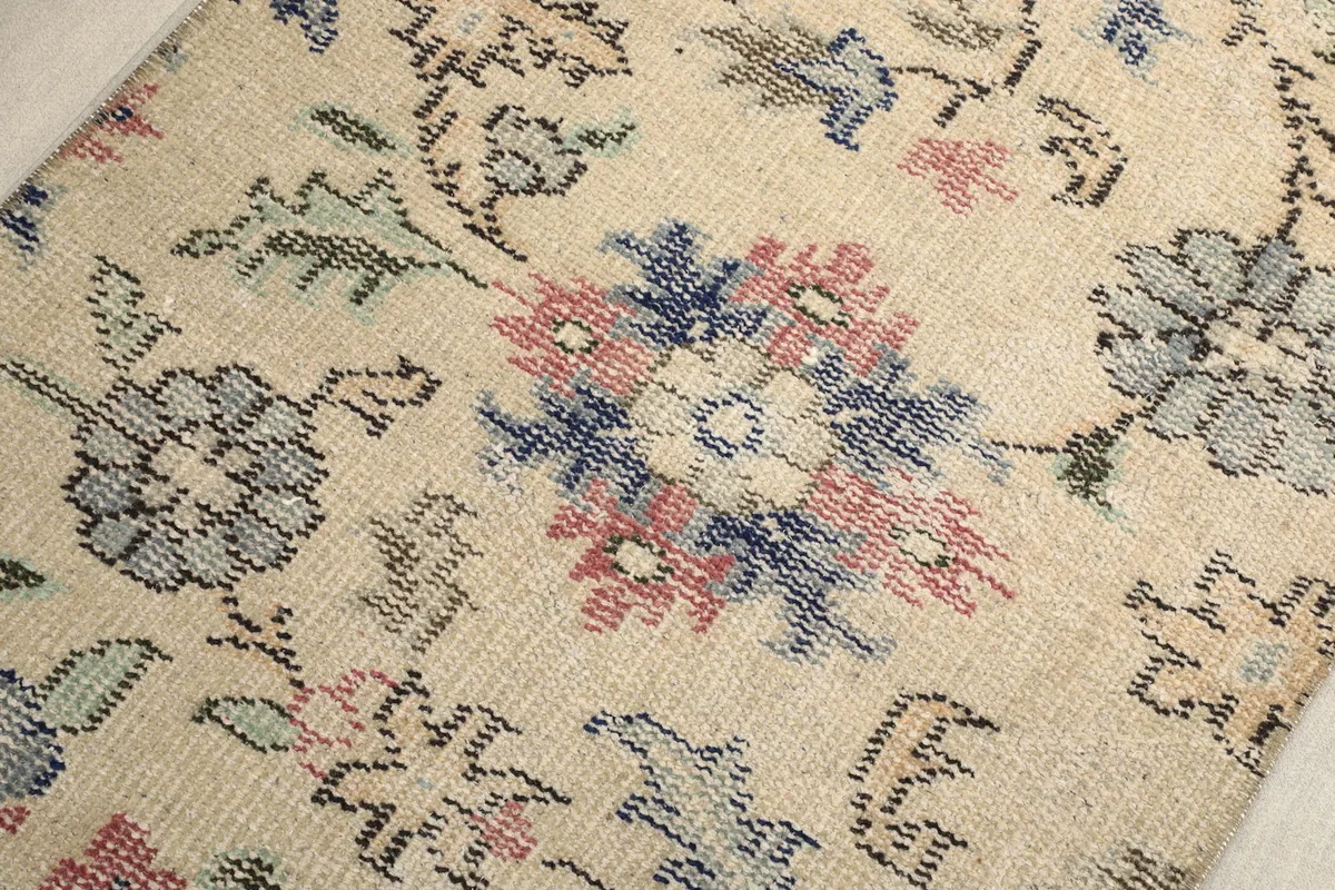Close-up of the hand-knotted texture and color variations in the wool pile