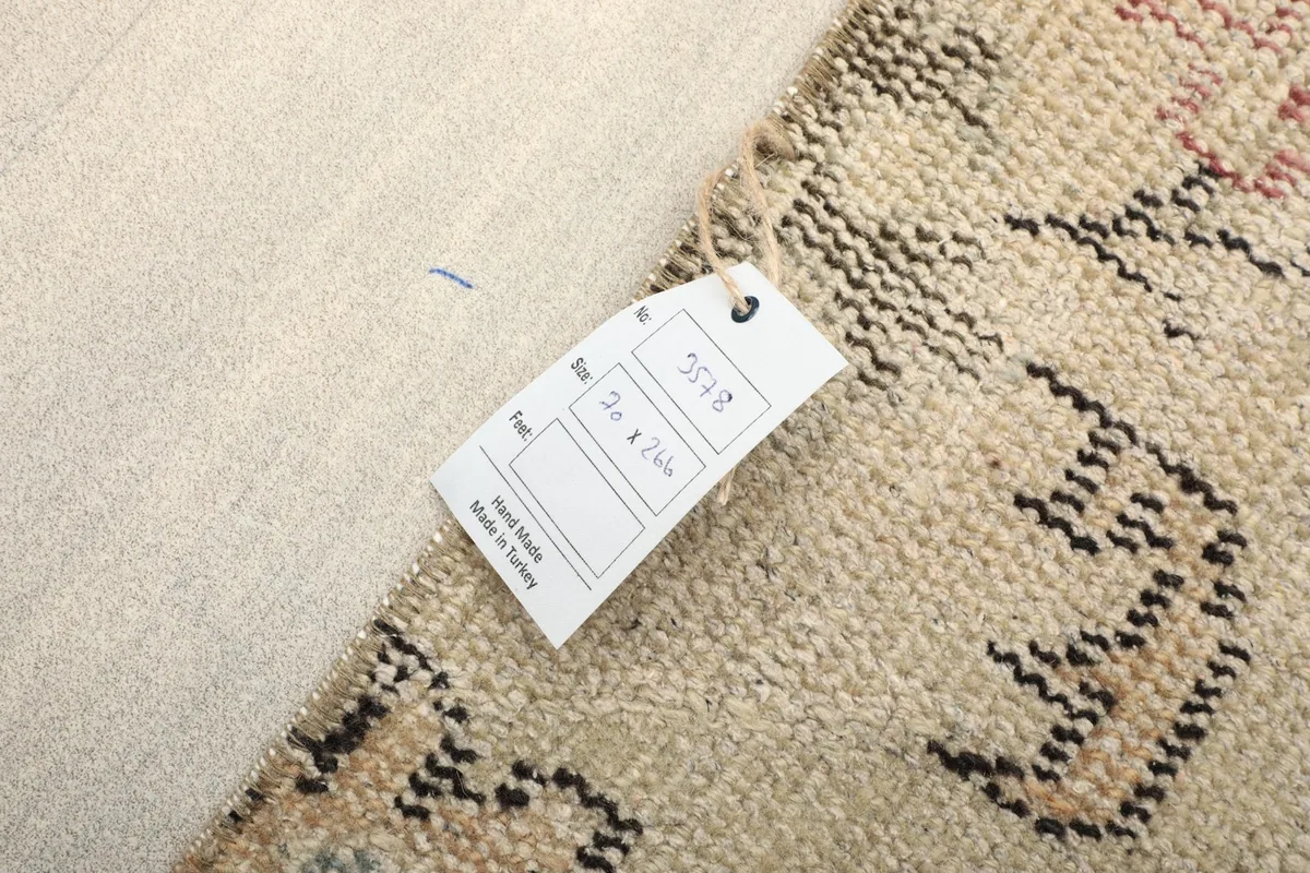 Back of the rug showing the label with size and origin details