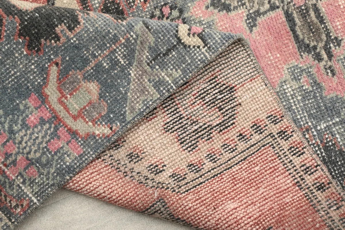 Another folded view showing the reverse side of the hand-knotted cotton foundation