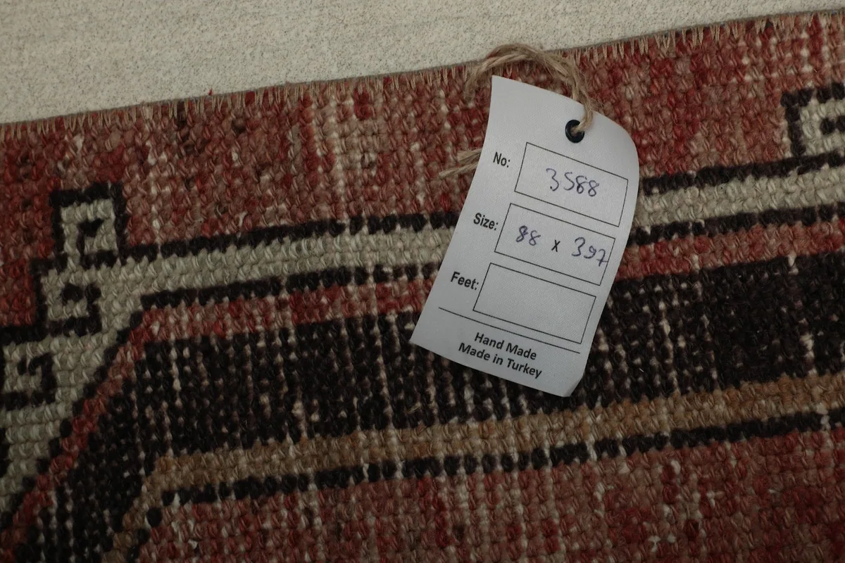 Tag displaying the rug's dimensions (88 x 397 cm) and origin, 'Hand Made in Turkey'.