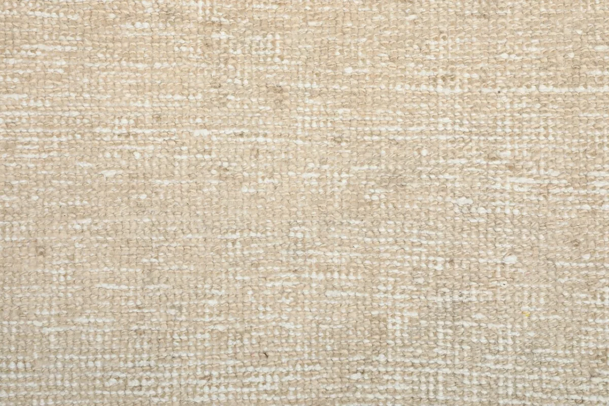 Tight close-up of the low wool pile, revealing the subtle weave and natural fiber character.