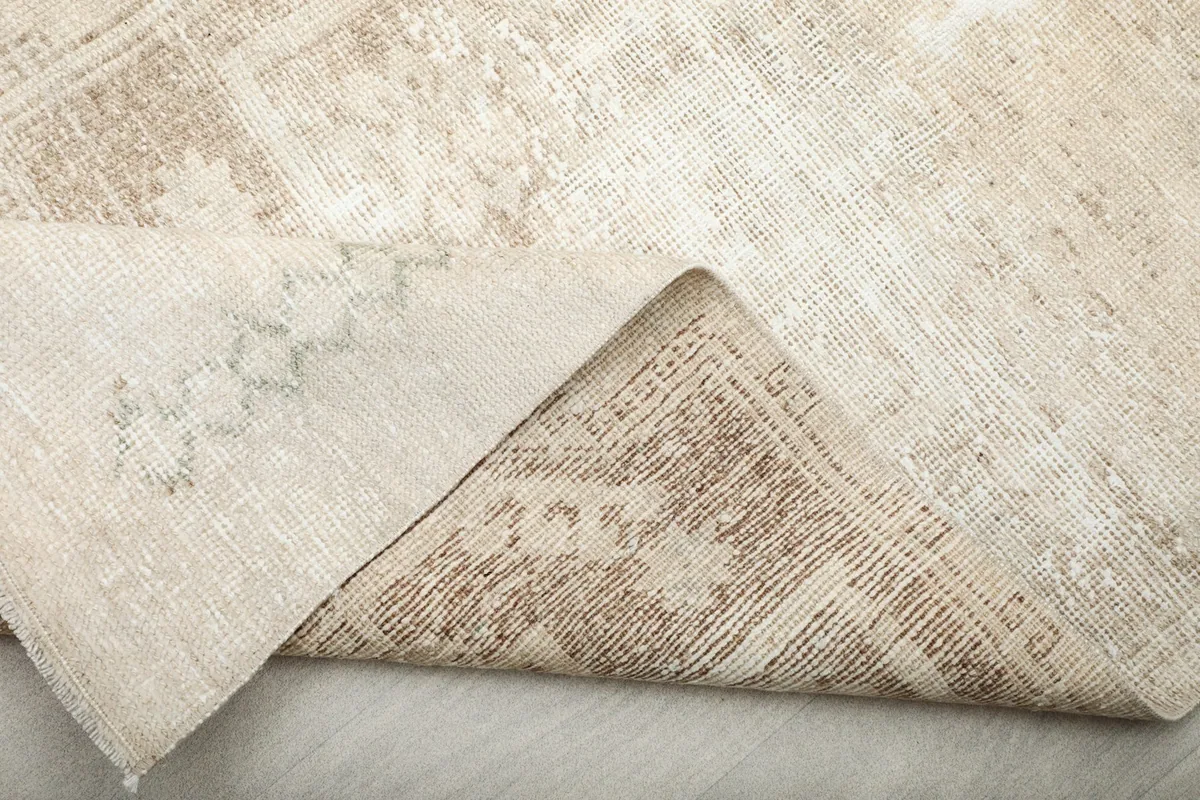 Another view of the rug's underside and corner, demonstrating the craftsmanship.