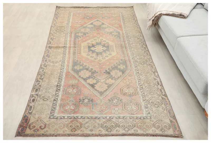 Full overhead view of the rust, gray, and beige vintage Anatolian wool rug