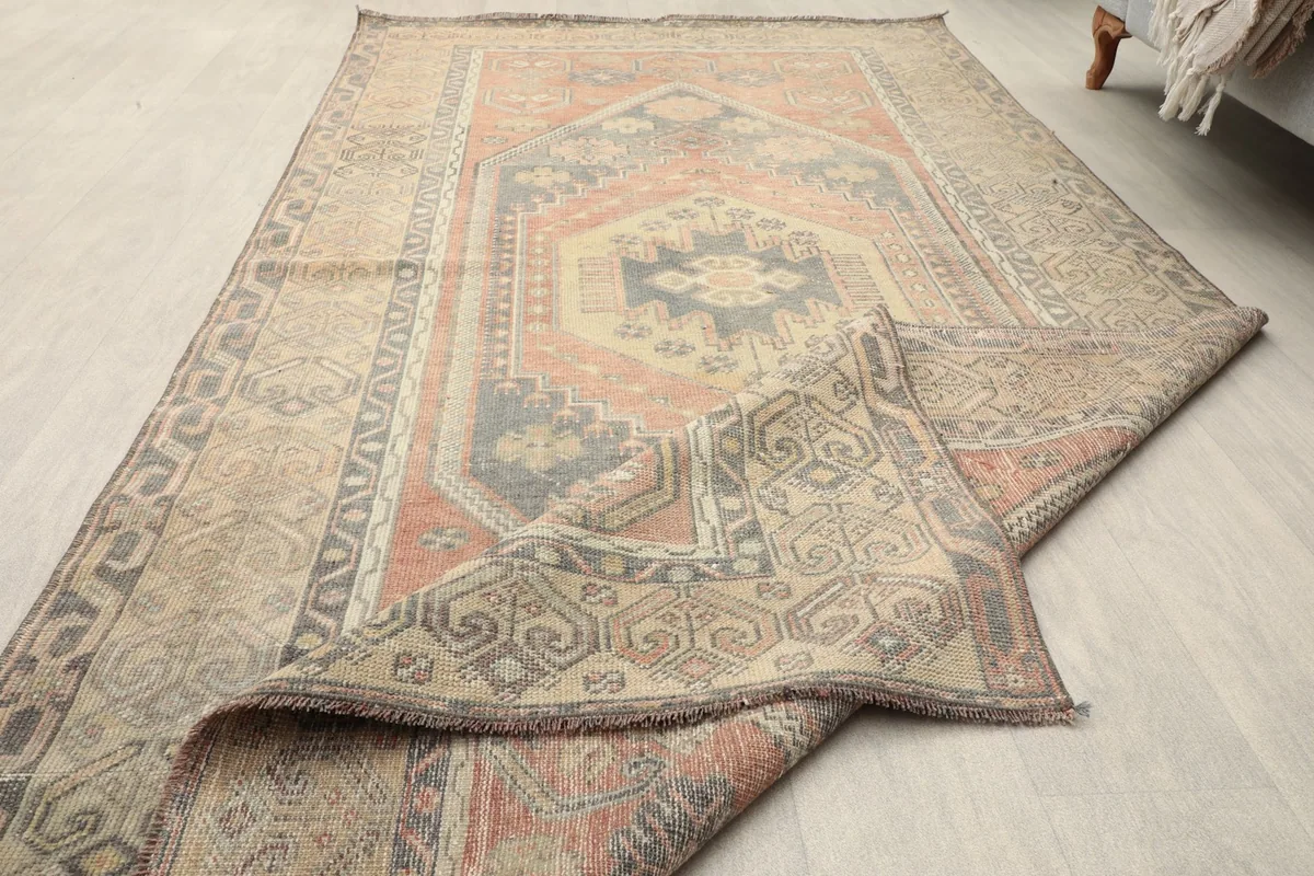 Close-up of the low pile and hand-knotted texture of the vintage Anatolian rug