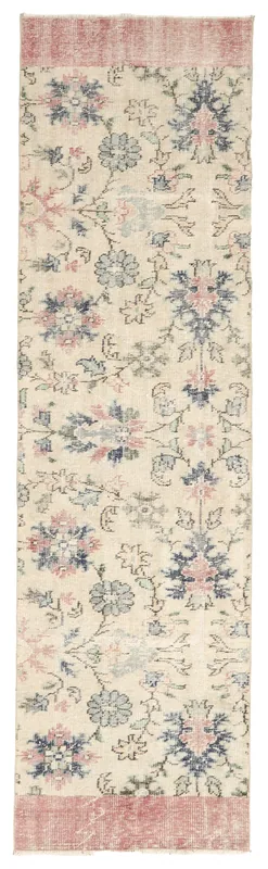 Full top view of the vintage Anatolian runner rug with an ivory field and rose and blue floral patterns.