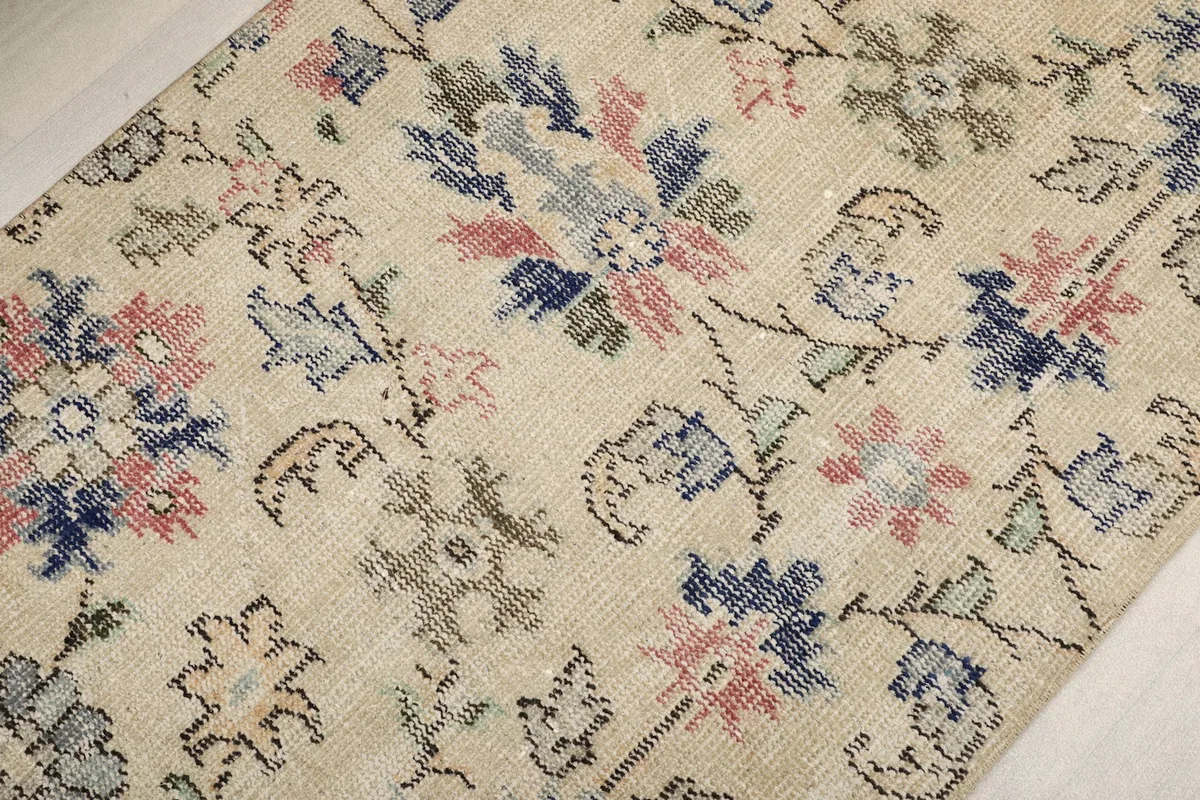 Close-up of the low pile showing the texture and colors of the hand-knotted wool.