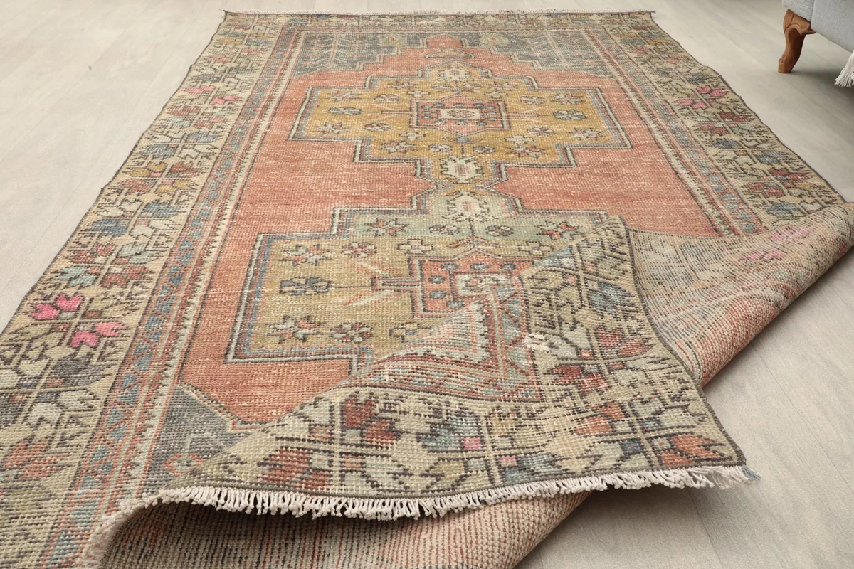 Overhead view of the rug with a corner folded back, displaying both front and back textures