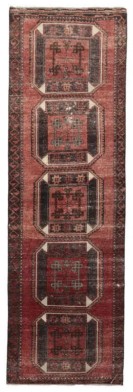 Full overhead view of the 3x11 vintage red and black geometric Anatolian runner on a white background.