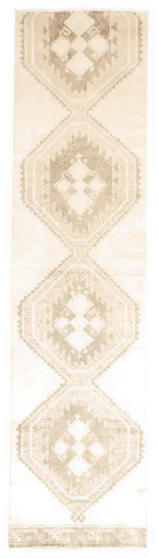 Full top view of the ivory and beige geometric runner rug with brown tribal motifs