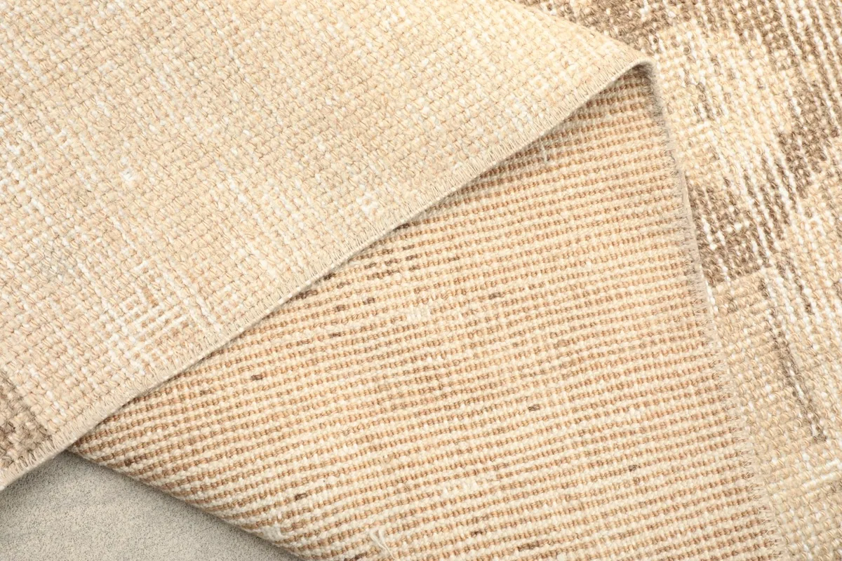 Close-up of the back of the rug, displaying the tight hand-knotted weave