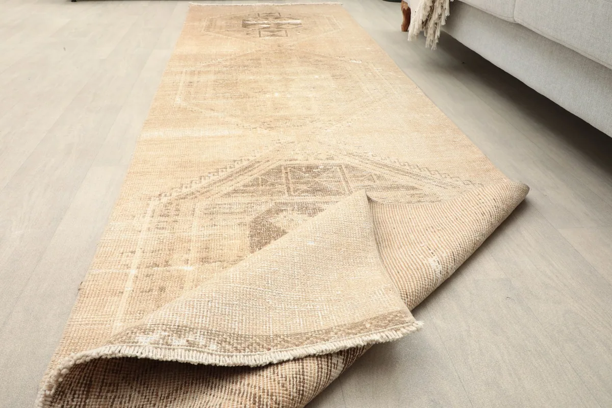 Runner partially folded to reveal the thickness and construction from an angle