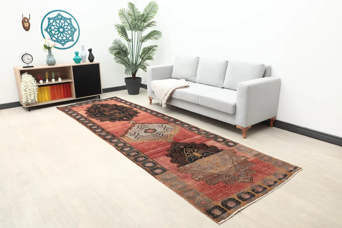 Anatolian runner rug in a room setting, showing its length and scale next to a sofa